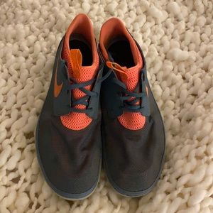 Orange and grey Men’s Nike Tennis shoes